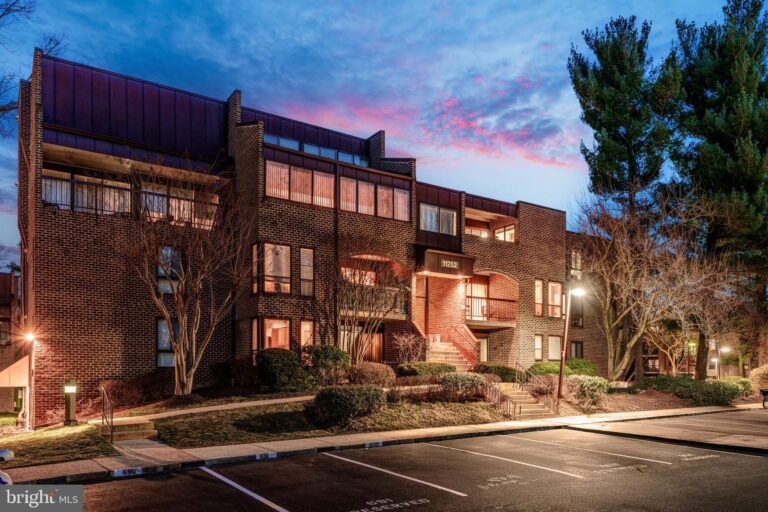 Brick condominium buildings at dusk, 11252 Chestnut Grove Square, Reston, VA