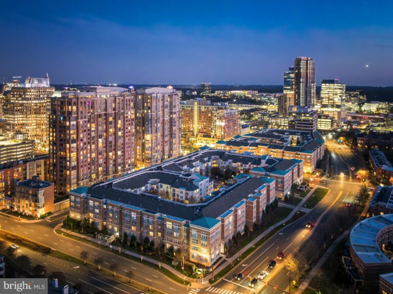 Aerial view of a condominium building at night, 12000 Market Street 149, Reston, VA
