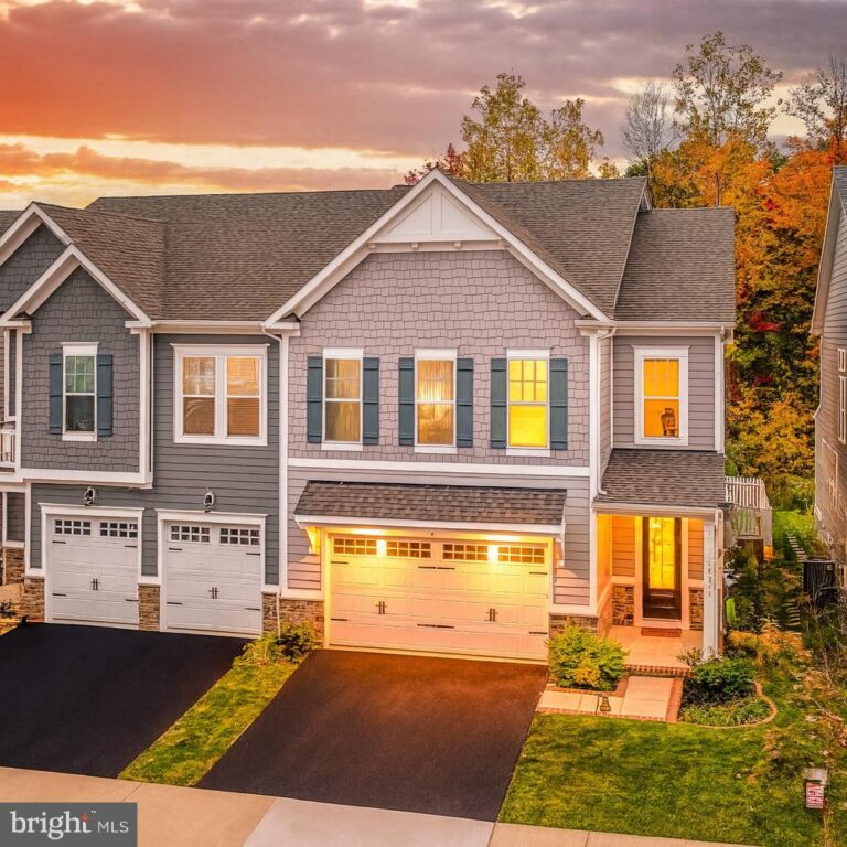 Two-story home with two-car garage at sunset, 18260 Moss Garden Road, Dumfries, VA