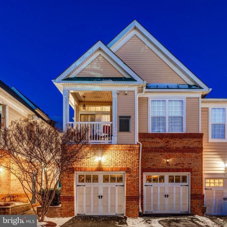 Townhome with two garages and balcony at night, 43920 Hickory Corner Terrace 110, Ashburn, VA