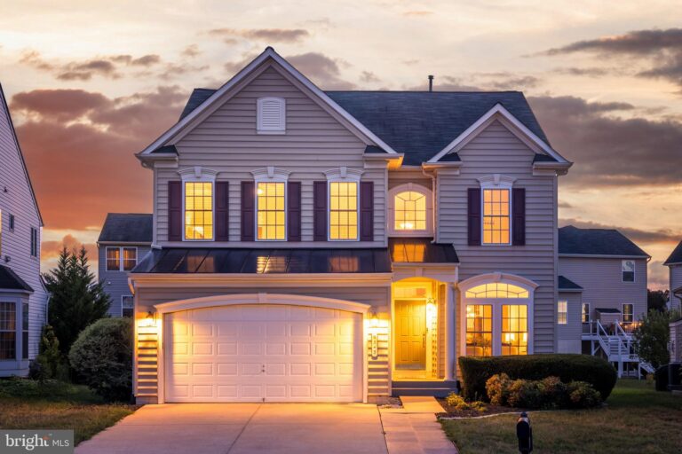 Two-story home with garage at dusk, 9343 Birch Cliff Drive, Fredericksburg, VA