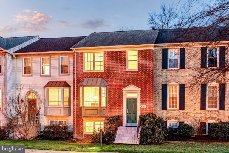Row of brick townhomes at dusk, 4261 Fox Lake Drive, Fairfax, VA