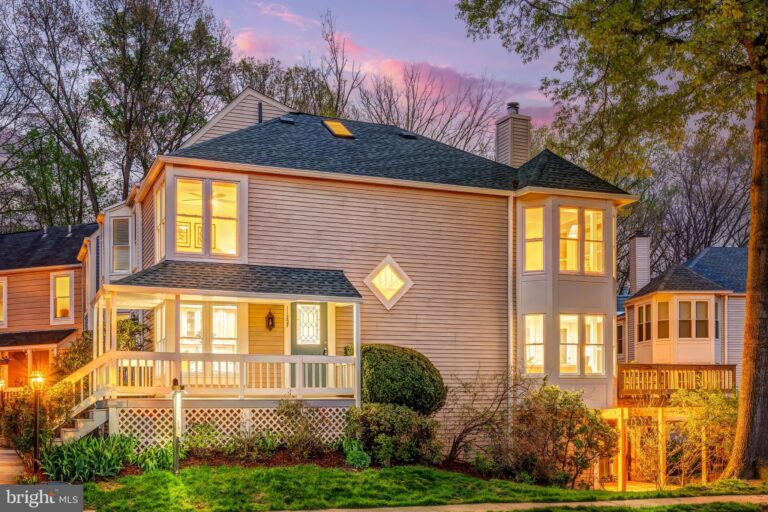 Two-story home with front porch at dusk, 11257 Silentwood Lane, Reston, VA