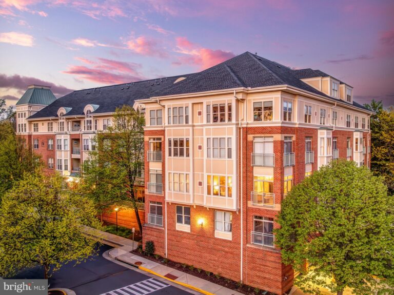 Brick condominium building at sunset, 1851 Stratford Park Place 212, Reston, VA