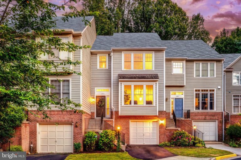Townhomes with garages at dusk, 1244 Weatherstone Court, Reston, VA