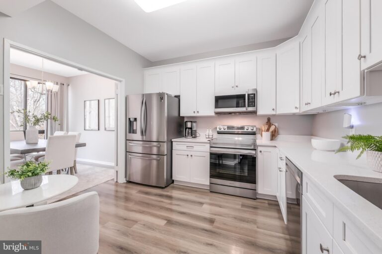 White kitchen with stainless steel appliances, 11564 Rolling Green Court 12/301B, Reston, VA