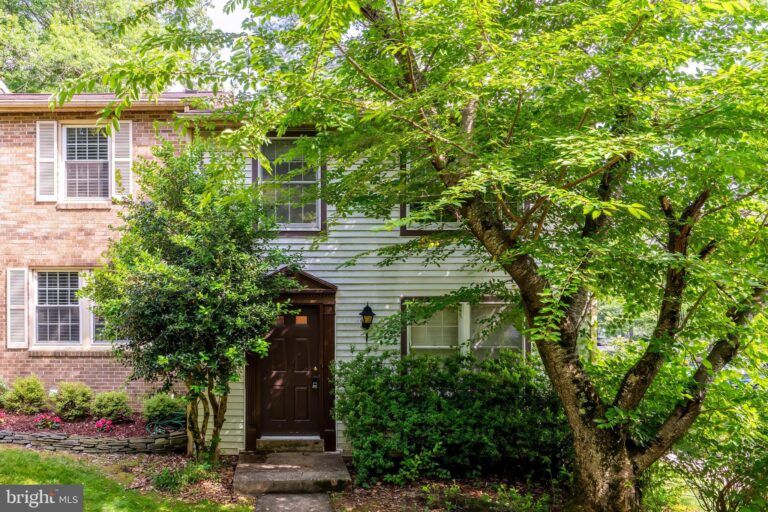 Townhome front door surrounded by trees, 11550 Ivy Bush Court, Reston, VA