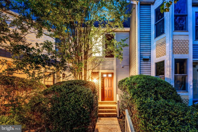 Townhome entrance framed by trees at dusk, 11213 Silentwood Lane, Reston, VA
