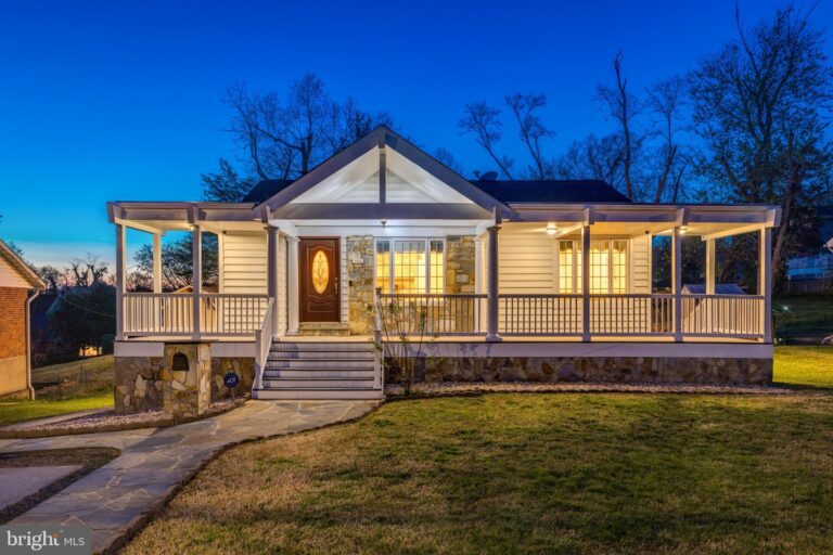 Home with wraparound front porch at dusk, 142 N French Street, Alexandria, VA