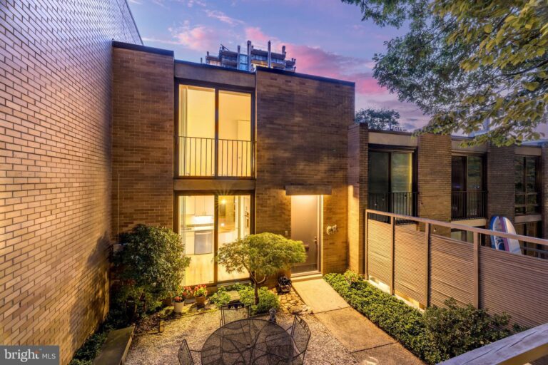 Contemporary townhome with wood siding at dusk, 1678 Chimney House Road, Reston, VA
