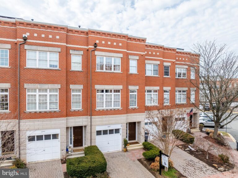 Row of brick townhomes with garages, 12147 Chancery Station Circle, Reston, VA