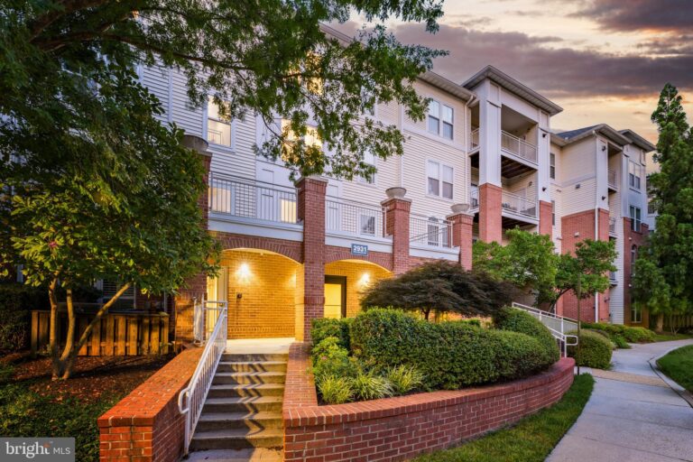 Condominium entrance with brick stairs at dusk, 2931 Deer Hollow Way 408, Fairfax, VA