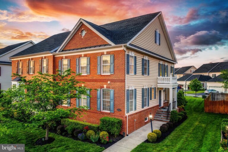 Brick-front home at sunset, 23412 Longollen Woods Terrace, Ashburn, VA