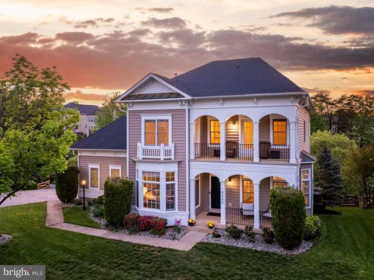 White home with two-story porch at sunset, 9266 Sumner Lake Boulevard, Manassas, VA
