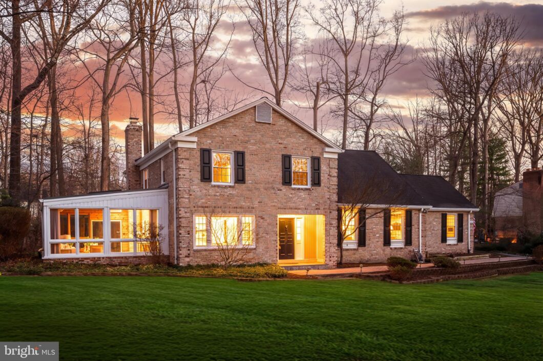 Brick-front home with large lawn at dusk, 2615 Steeplechase Drive, Reston, VA