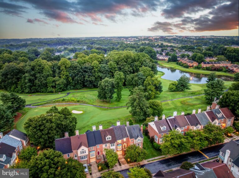 Aerial view of a community beside a golf course and pond, 3839 Inverness Road, Fairfax, VA