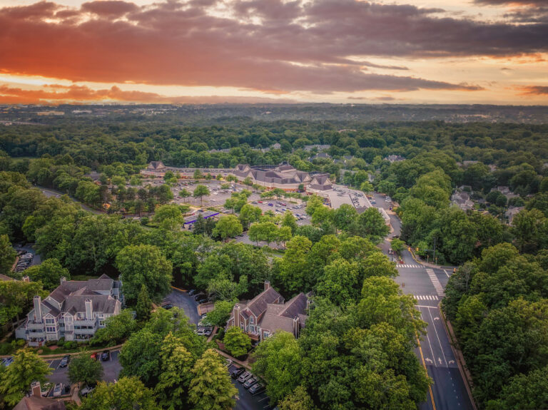 Aerial view of North Point Village Center shopping plaza at sunset