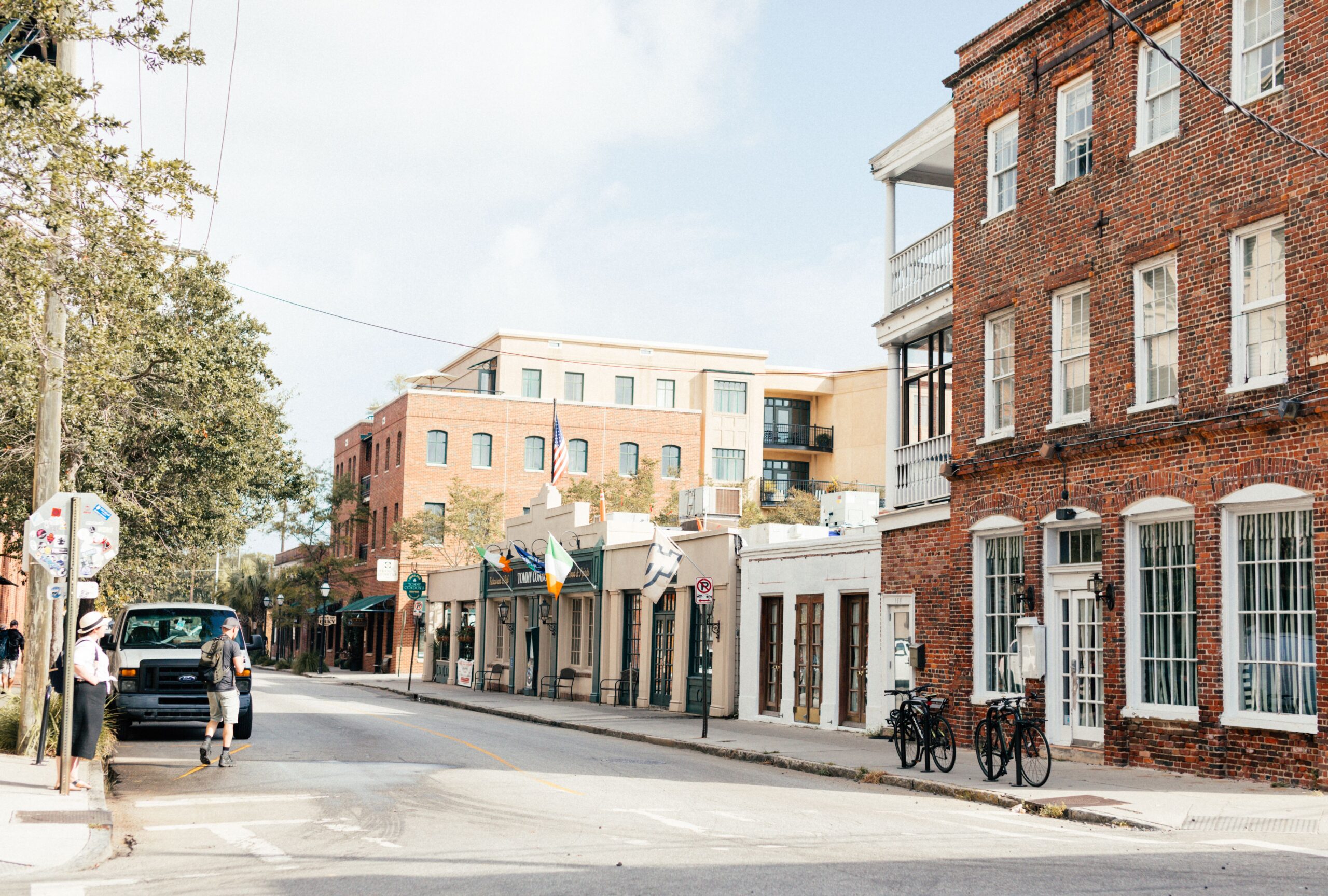 Quiet tree-lined street with colonial brick homes