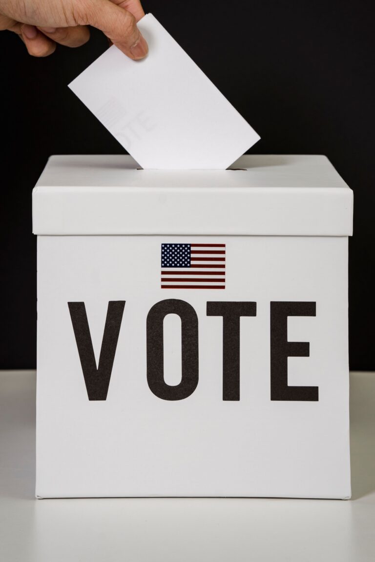 White ballot box with American flag and VOTE text