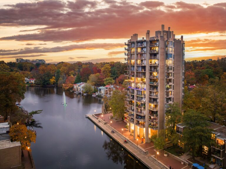 Condominium tower at sunset overlooking a lake in Reston, Virginia