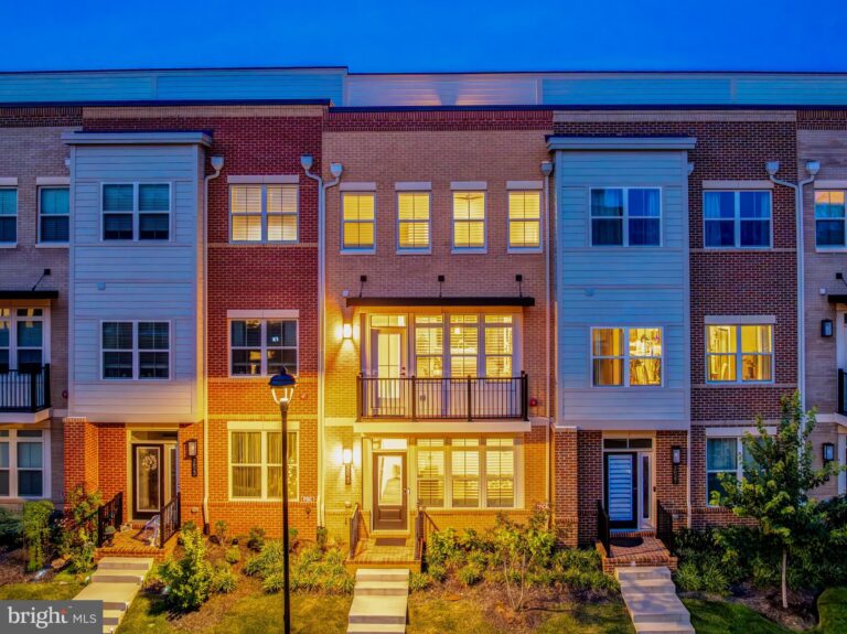 Row of three-story townhomes at dusk, 3825 Tussica Way, Fairfax, VA