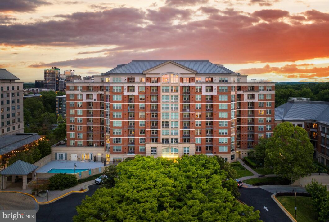Brick mid-rise condominium building at sunset, 11760 Sunrise Valley Drive 813, Reston, VA