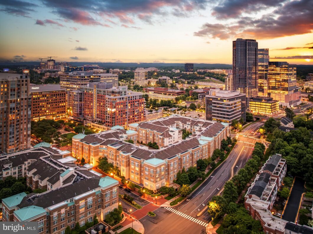 Aerial view of mid-rise buildings at dusk, 12001 Market Street 429, Reston, VA