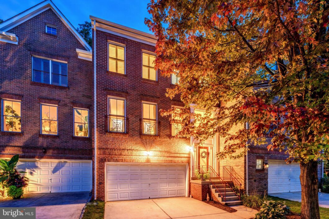 Brick townhome with garage beside an autumn tree, 1680 Waterhaven Drive, Reston, VA