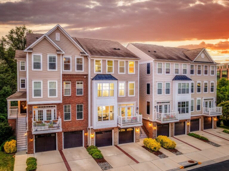 Brick and siding townhomes at sunset in Aldie, Virginia