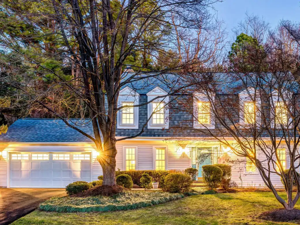 White colonial home under a blue sky in Fairfax County, Virginia
