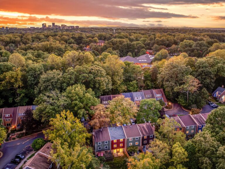 Aerial view of Forest Edge cluster townhomes among mature trees in Reston, Virginia