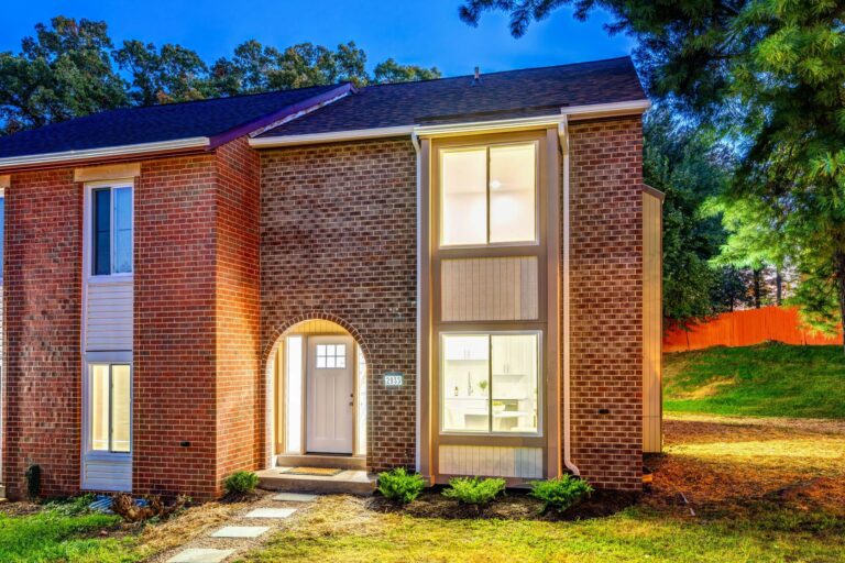 Renovated brick end-unit townhome in Lake Ridge, Woodbridge VA, photographed at dusk