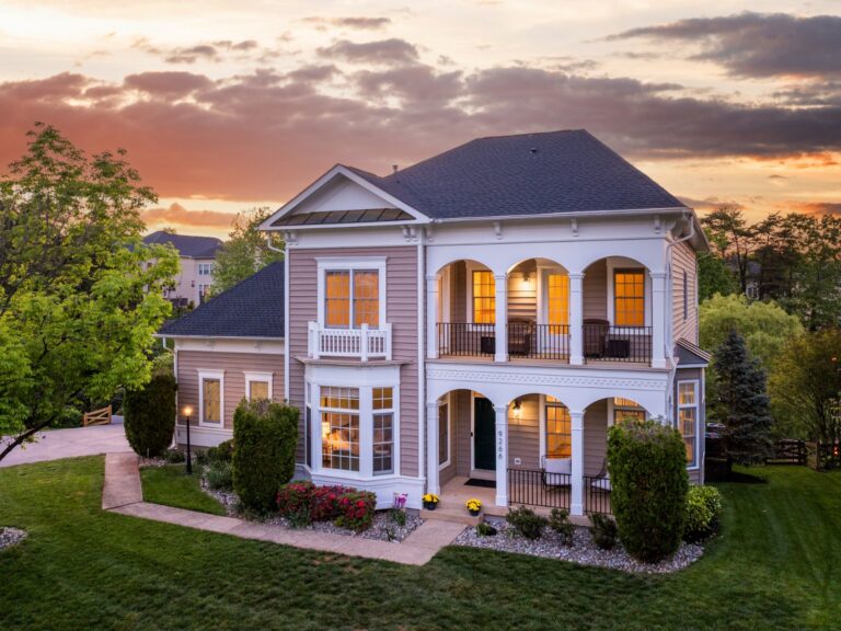 Two-story home with covered porches at sunset in Manassas, Virginia