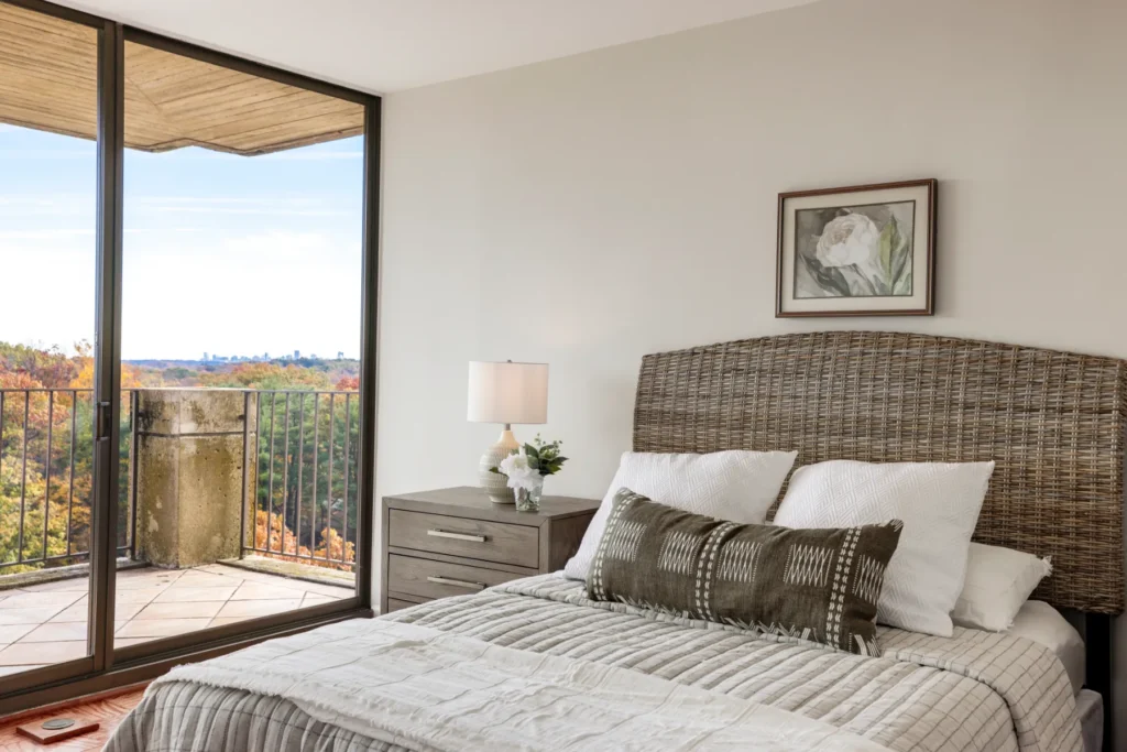 Primary bedroom with a treetop view